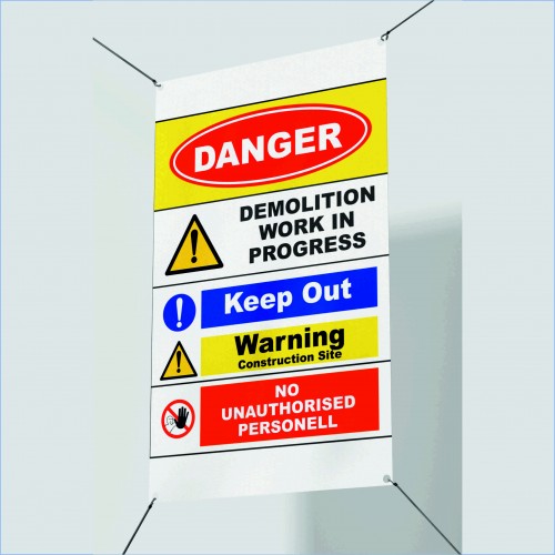 Danger Demolition in Progress safety sign banner at construction site